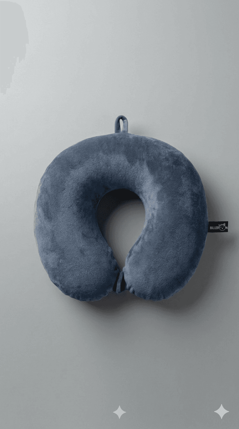 Plush blue U-shaped travel neck pillow with a hanging loop on a grey background.